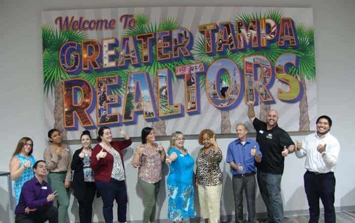 Greater Tampa Realtors Welcome To Giant canvas art with "Welcome Clearwater Tampa Realtors" with group in front