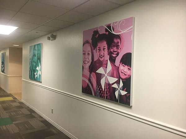 Faith Covenant Church2 Big corporate art of four girls in hall
